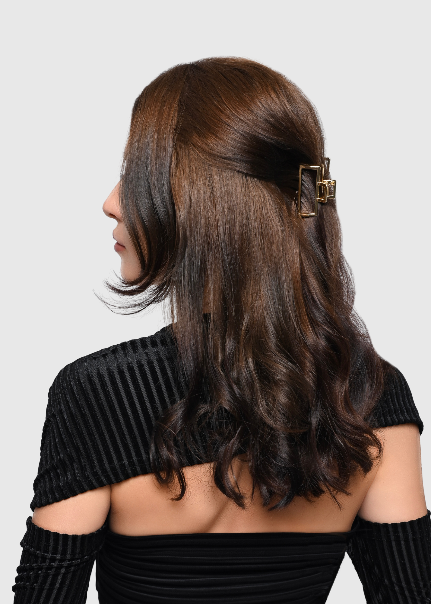 Gold metal claw clip pulled back style