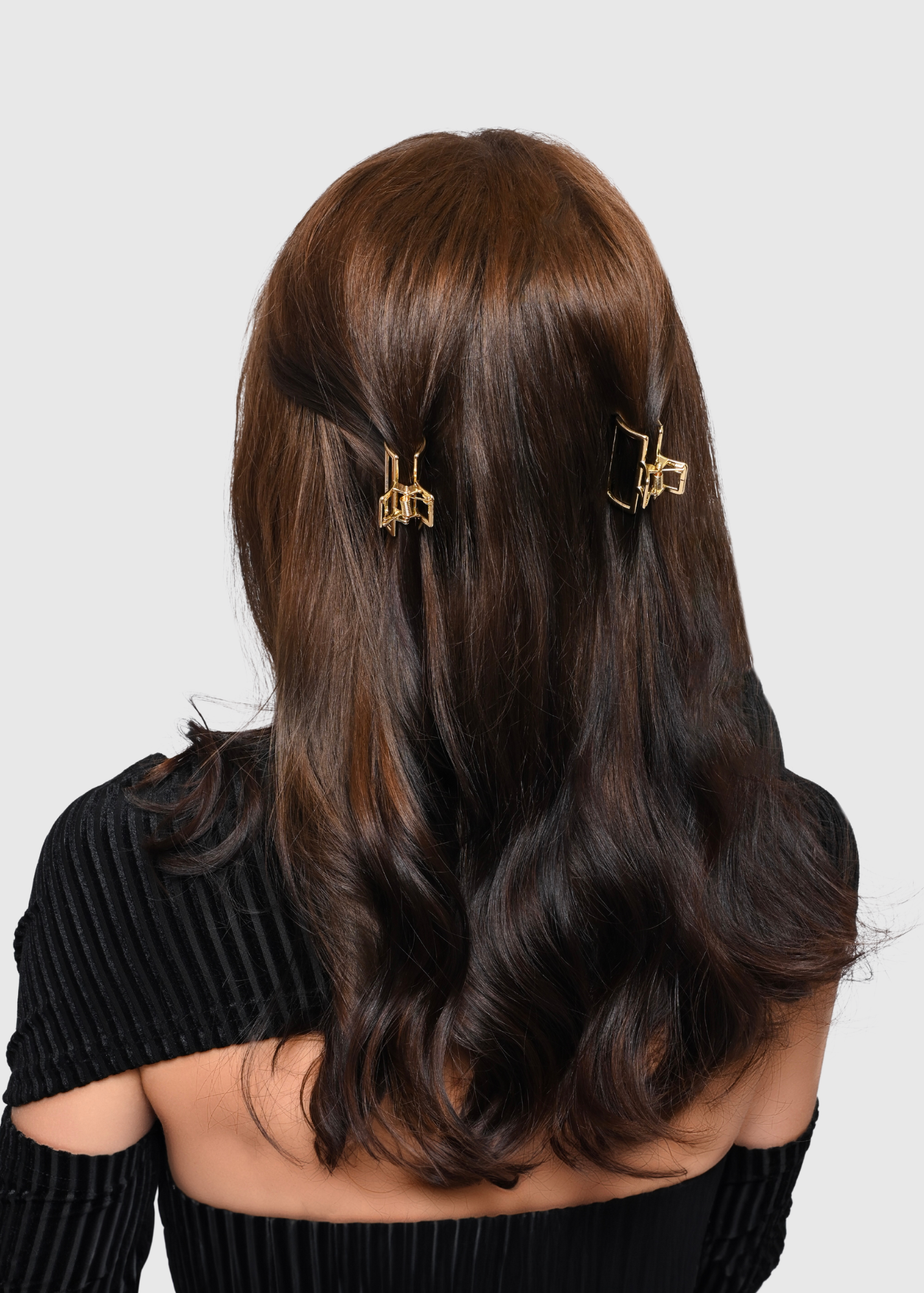 small gold metal claw clip set styled in half do