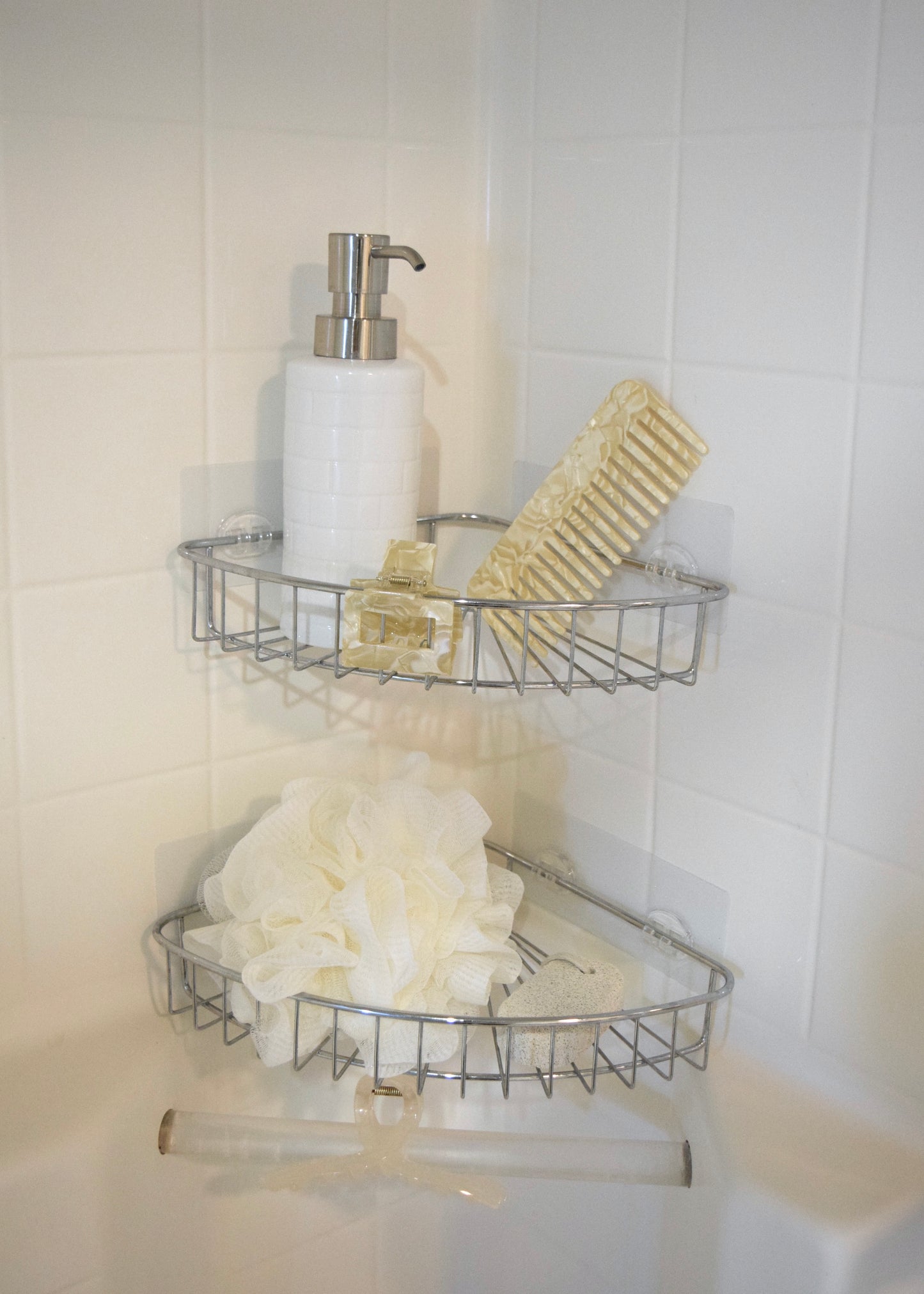 Marble wide tooth detangling comb placed on shower shelf