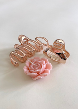 Load image into Gallery viewer, Small rose gold claw clip next to sakura flower
