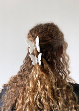 Load image into Gallery viewer, White Butterfly Clip set on curly hair

